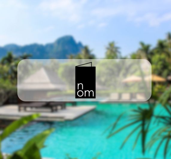 nom logo with resort pool in background