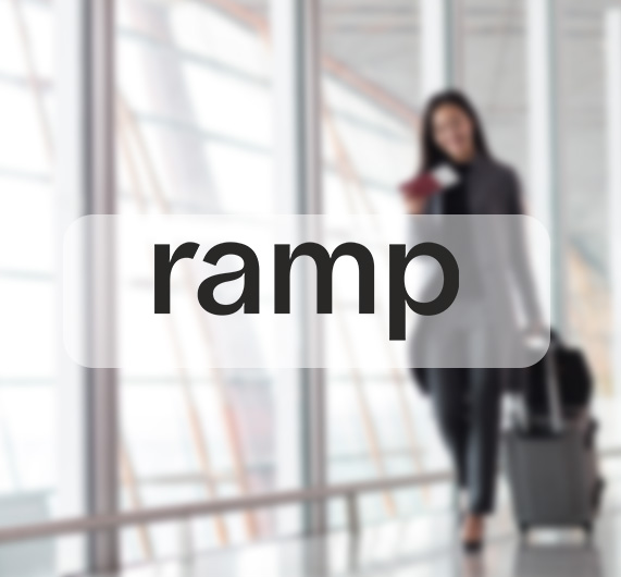 ramp logo with business traveler in background