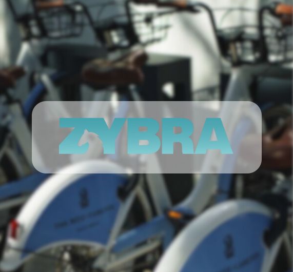 Zybra logo with ritz carlton bikes in background