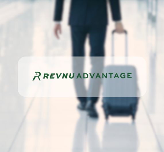 RevnuAdvantage logo with business traveler in background with suitcase