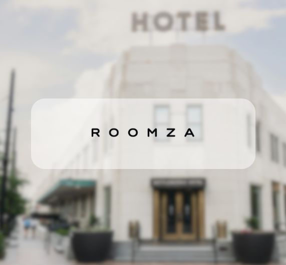 Roomza logo over a picture of a hotel